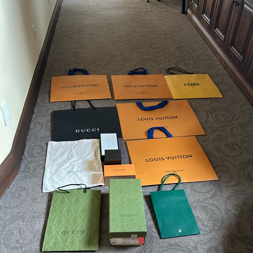 Louis Vuitton bags and an assortment of boxes and bags.